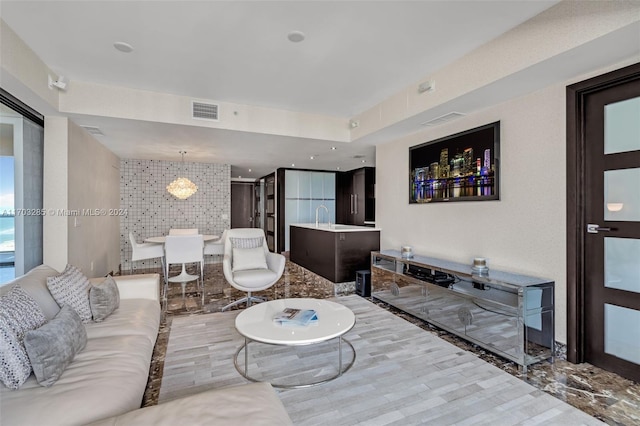 living room with wood-type flooring and tile walls