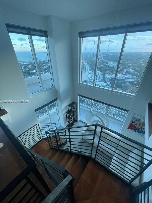 stairway featuring wood-type flooring