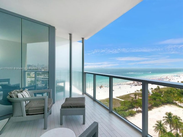 balcony with a view of the beach and a water view