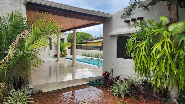 view of pool featuring a patio