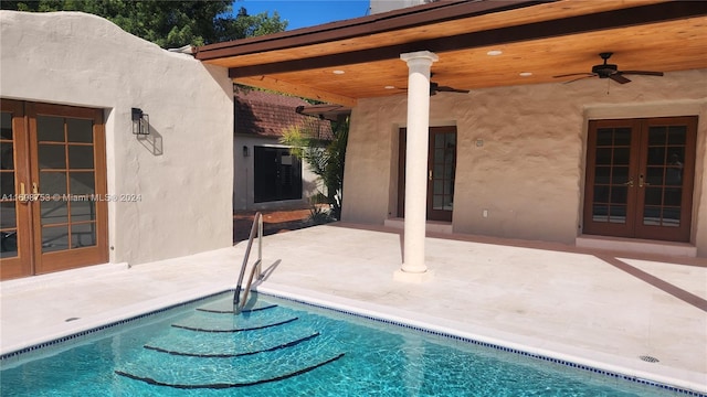 view of pool featuring french doors, a patio, and ceiling fan