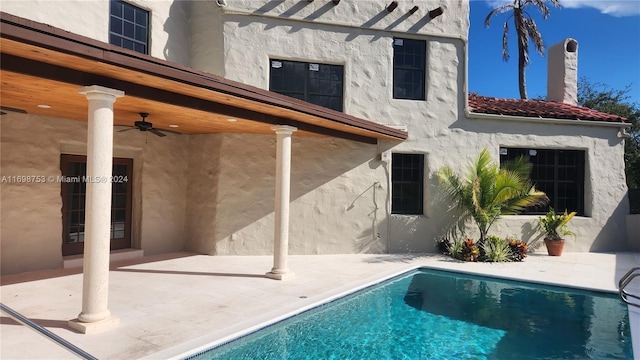 back of property with a patio area and ceiling fan