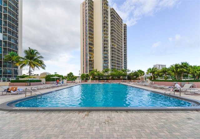 view of swimming pool featuring a patio area