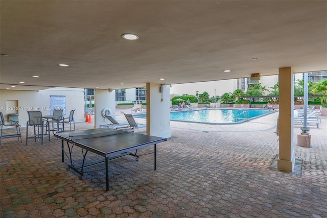 view of swimming pool featuring a patio