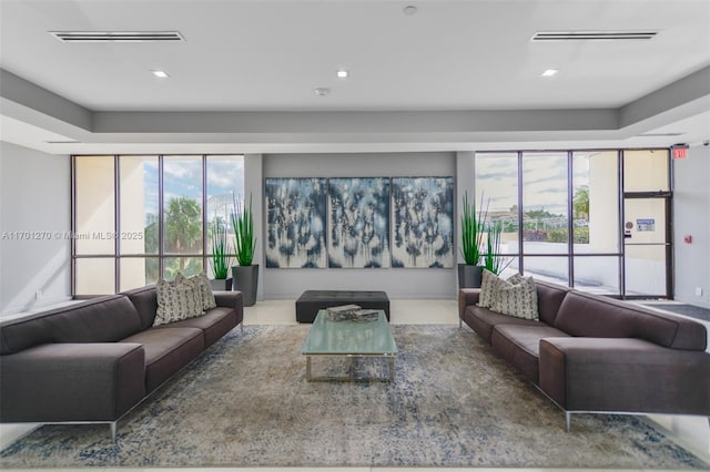 tiled living room with a healthy amount of sunlight