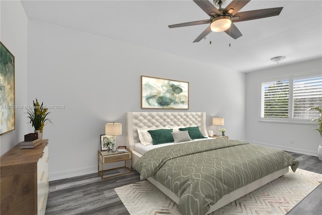 bedroom featuring ceiling fan and dark hardwood / wood-style flooring