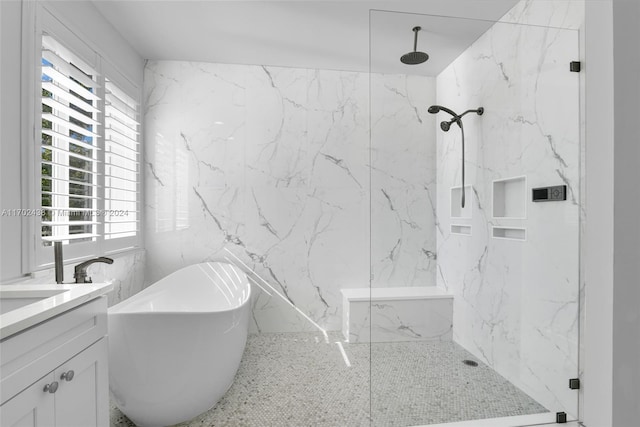 bathroom featuring vanity, separate shower and tub, and a healthy amount of sunlight