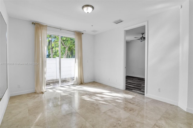 unfurnished room featuring ceiling fan