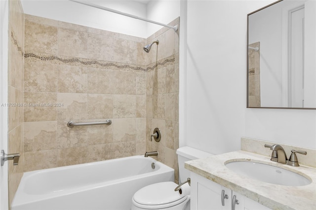 full bathroom featuring vanity, toilet, and tiled shower / bath