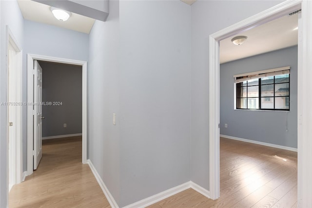 hallway with light wood-type flooring