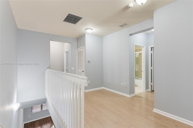 corridor featuring light wood-type flooring