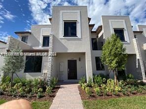 view of front of house featuring stucco siding