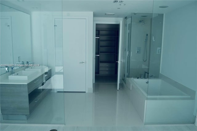 bathroom featuring tile patterned flooring, vanity, and independent shower and bath