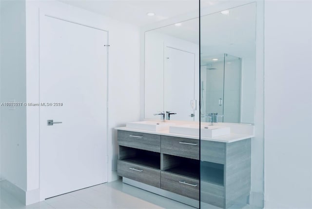 bathroom featuring vanity and an enclosed shower