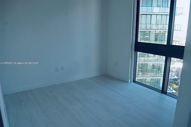 unfurnished room featuring a wealth of natural light