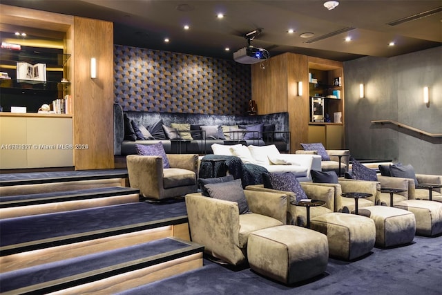 home theater with built in shelves and carpet floors