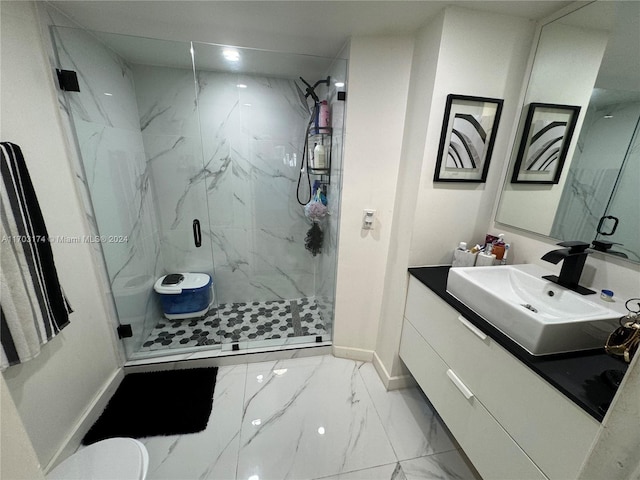 bathroom featuring vanity and an enclosed shower