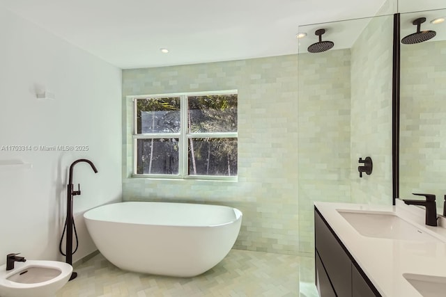 bathroom featuring vanity, a bidet, plus walk in shower, and tile walls