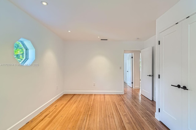 unfurnished room featuring light hardwood / wood-style floors