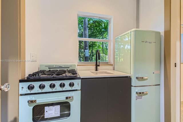 kitchen with white appliances and sink