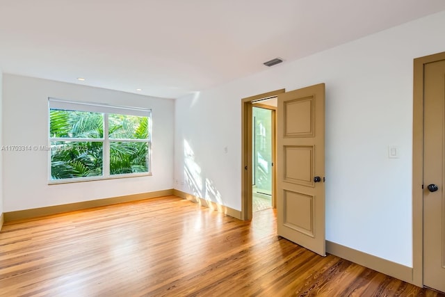 empty room featuring light hardwood / wood-style floors