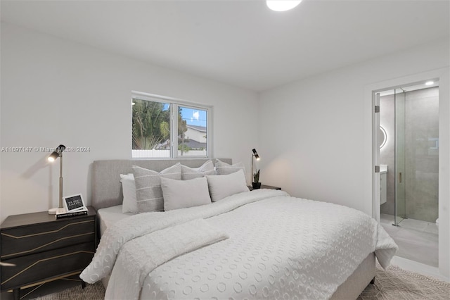 bedroom with carpet flooring and ensuite bathroom