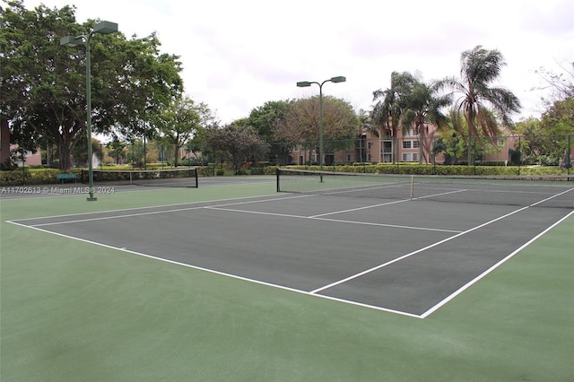 view of tennis court with basketball court