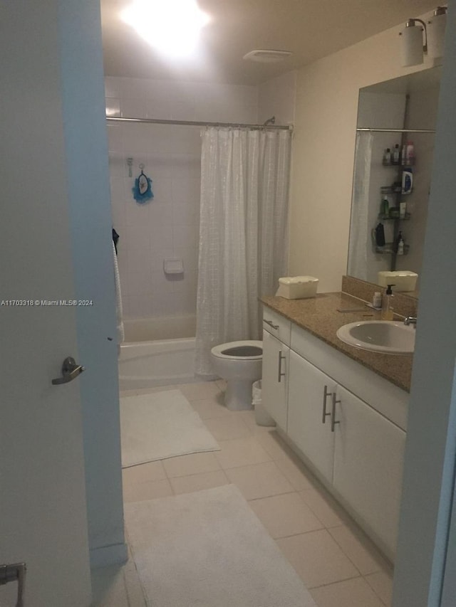 full bathroom featuring tile patterned floors, shower / bath combo, toilet, and vanity