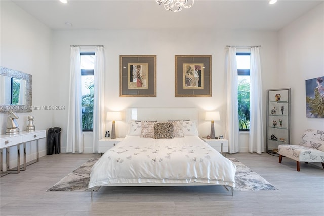 bedroom with light hardwood / wood-style flooring