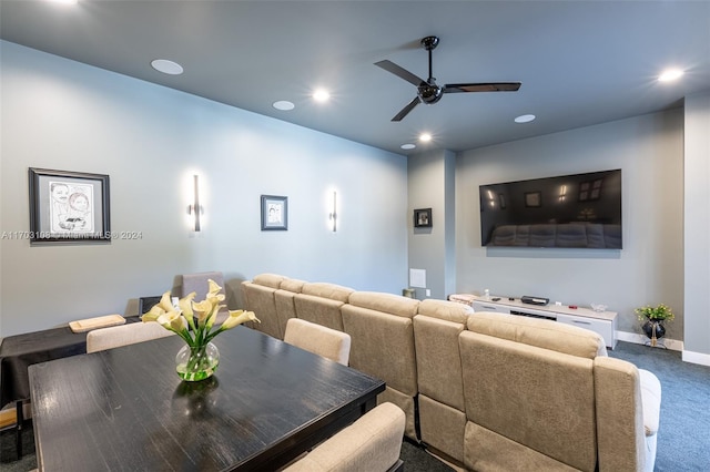 cinema with ceiling fan and dark carpet