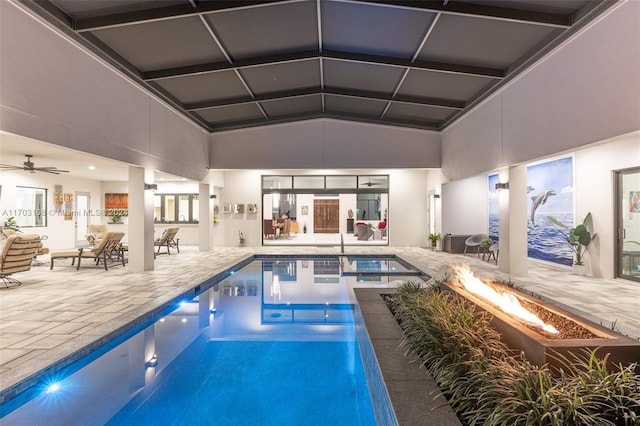 view of swimming pool featuring ceiling fan