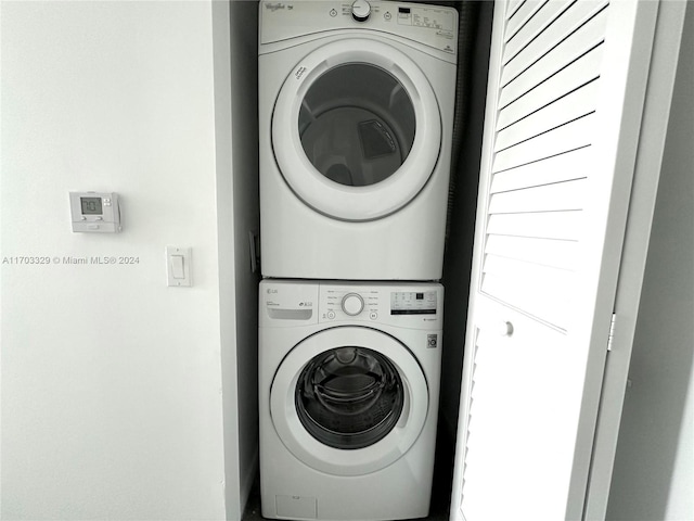 washroom with stacked washer / dryer