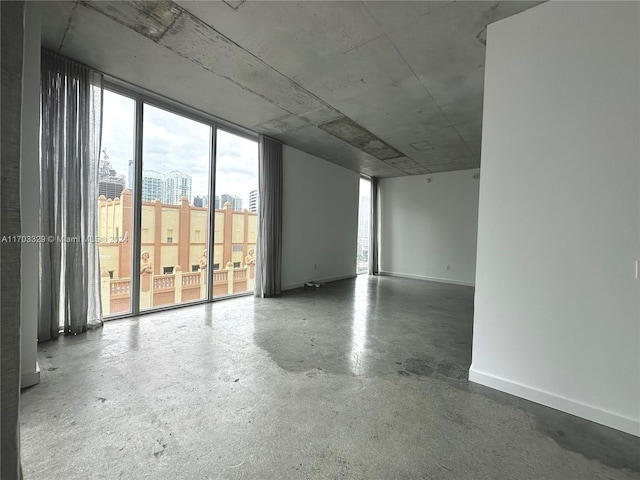 empty room with concrete flooring