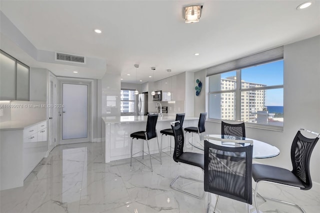 dining area with a water view