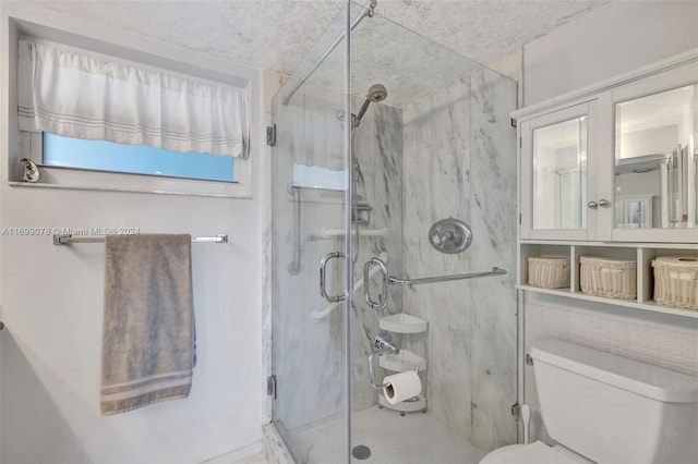 bathroom featuring toilet and walk in shower