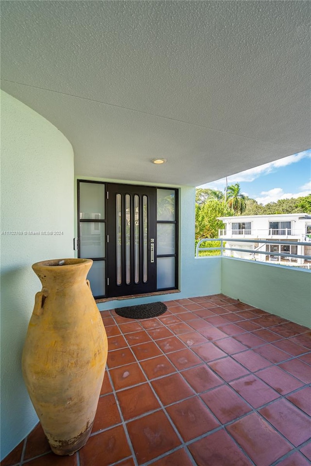 entrance to property featuring a balcony