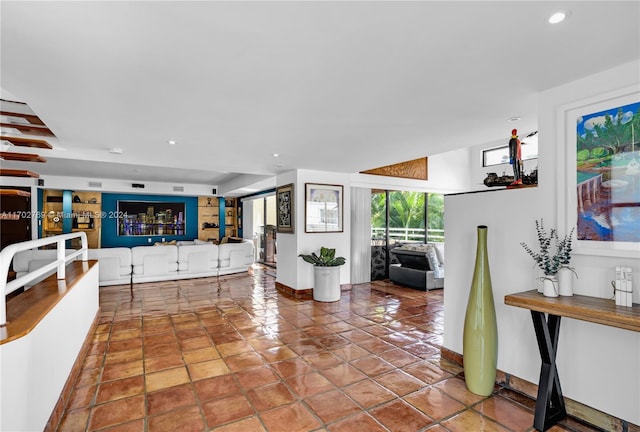 living room with tile patterned floors