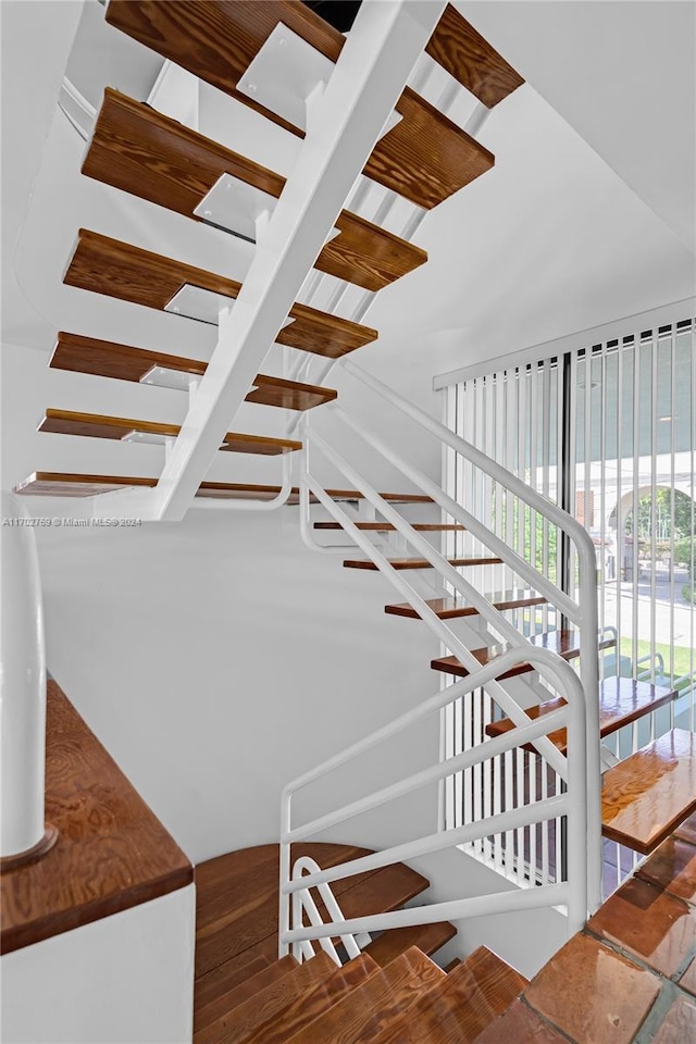 stairway with wood-type flooring