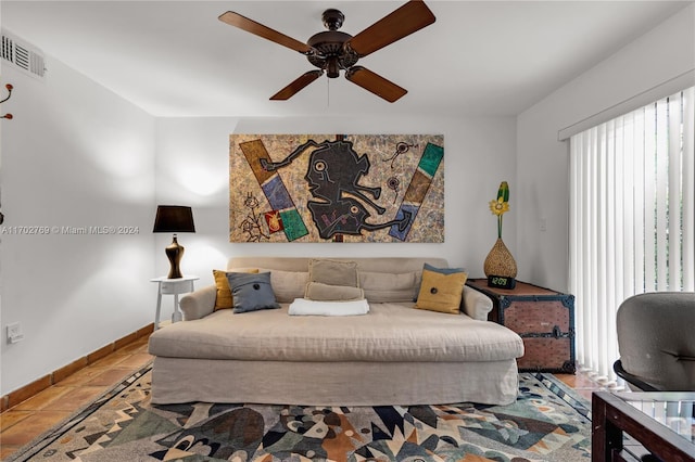 bedroom featuring ceiling fan and tile patterned flooring