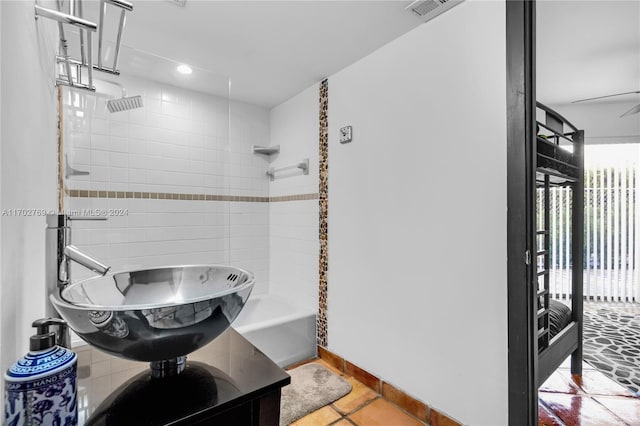 bathroom with ceiling fan, tile patterned flooring, and sink