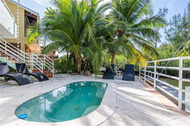 view of swimming pool featuring a patio area