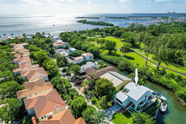 birds eye view of property with a water view