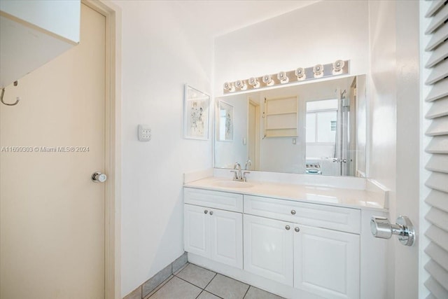 bathroom featuring tile patterned floors and vanity