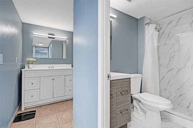 bathroom with a shower with curtain, tile patterned floors, vanity, and toilet