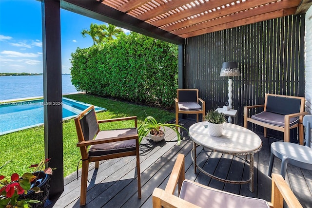 wooden terrace with a water view, an outdoor pool, and a pergola