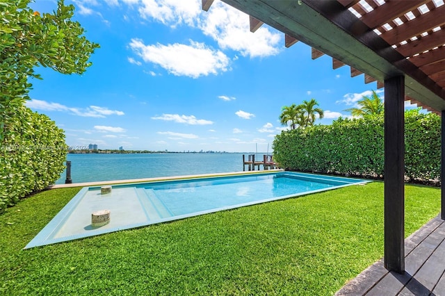 outdoor pool featuring a water view and a yard