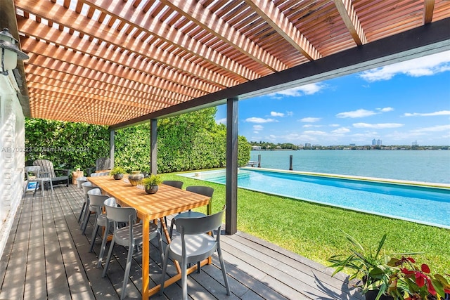 wooden terrace with an outdoor pool, a water view, outdoor dining area, a yard, and a pergola