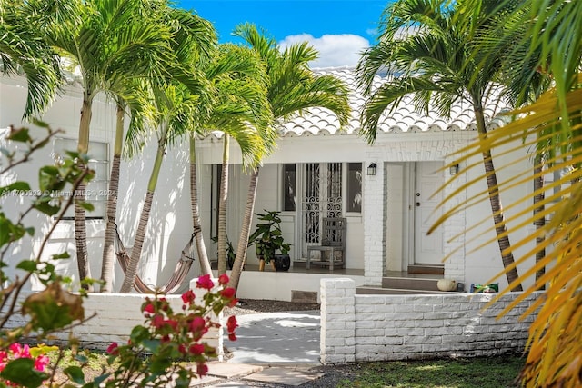 property entrance with a tiled roof