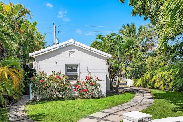 view of property exterior featuring a yard