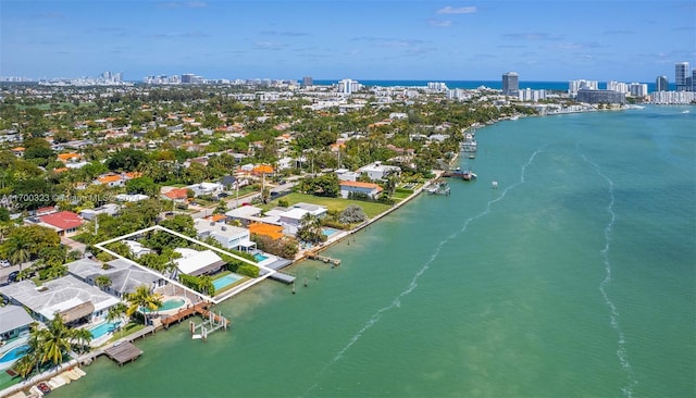 bird's eye view featuring a view of city and a water view